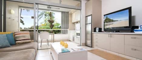 Appartement Familial (Deluxe) | Coin séjour | Télévision à écran plat, lecteur de DVD