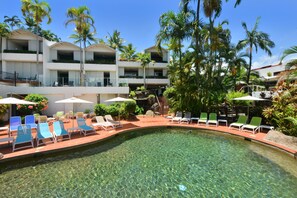 Outdoor pool, open 7:00 AM to 9:00 PM, pool umbrellas, pool loungers