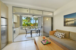 Club Studio with Water Garden Views | Living area | Flat-screen TV, DVD player - Club Tropical Resort Port Douglas (Port Douglas)