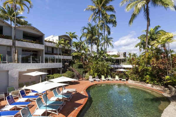 Outdoor pool, open 7:00 AM to 9:00 PM, pool umbrellas, pool loungers