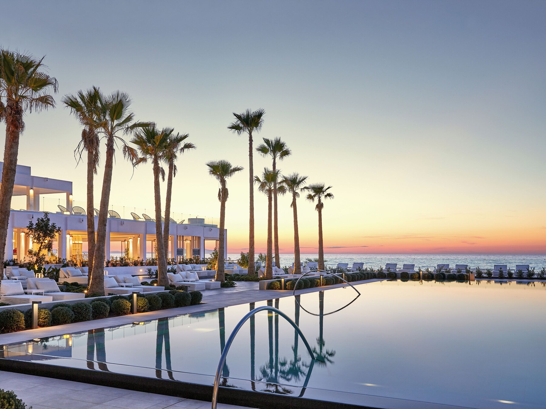 Seasonal outdoor pool, pool umbrellas, pool loungers