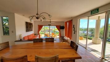 Villa | Living area | 32-inch flat-screen TV with cable channels, TV, DVD player