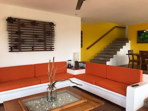 Villa | Living room | 32-inch flat-screen TV with cable channels, TV, DVD player