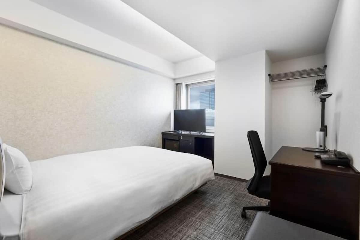 Desk, blackout curtains, free WiFi, bed sheets