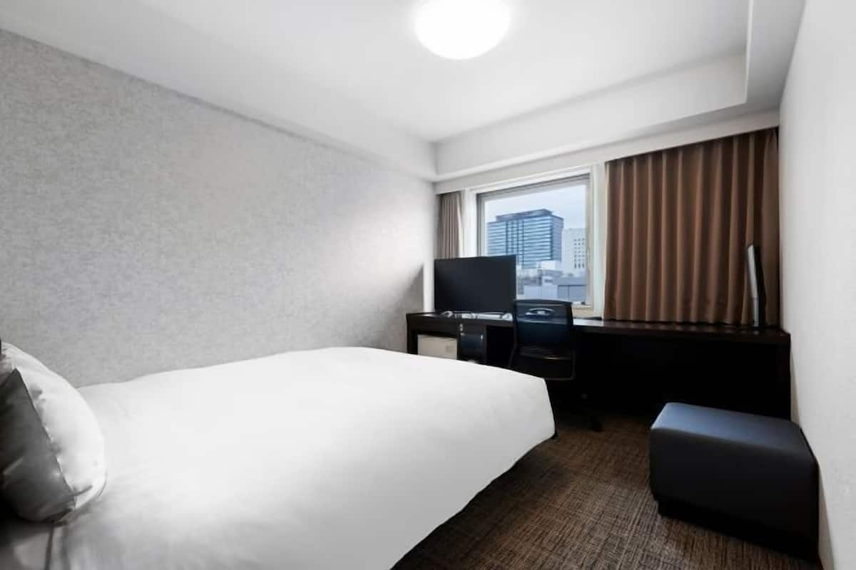 Desk, blackout curtains, free WiFi, bed sheets
