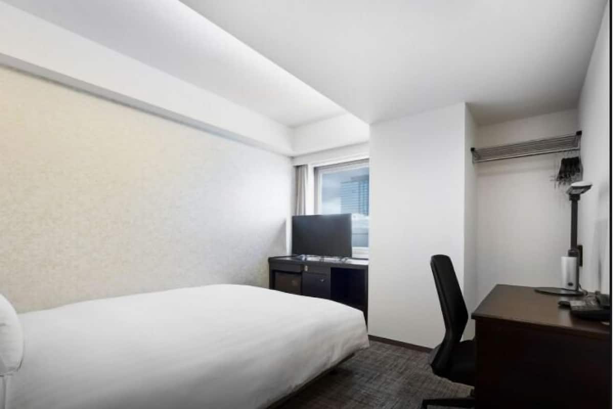 Desk, blackout curtains, free WiFi, bed sheets