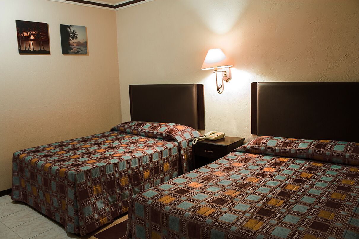 Desk, blackout drapes, bed sheets