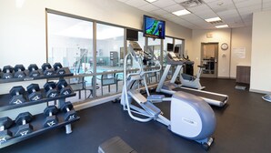 A gym with treadmills, elliptical machines, and dumbbells. - Holiday Inn Express Leland - Wilmington Area by IHG (Leland)