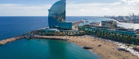 On the beach, sun loungers, beach umbrellas, beach towels
