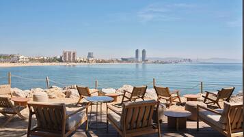 On the beach, sun-loungers, beach umbrellas, beach towels