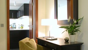 A room with a wooden desk, a chair, a mirror, and a potted plant. - Atelier EC1 by Bridgestreet (London)
