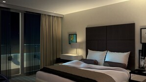 A modern hotel room with a large bed, a bedside table, a nightstand, a glass door leading to a balcony, and a painting on the wall. - Atelier EC1 by Bridgestreet (London)