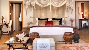 A spacious bedroom with a large bed, a canopy, and a bedside table with a tray of fruits and a vase of flowers. - Tiara Yaktsa Côte d'Azur (Theoule-sur-Mer)