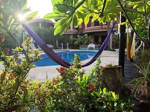 Outdoor pool, pool umbrellas - Hotel Cabanas Maria del Mar (Isla Mujeres)