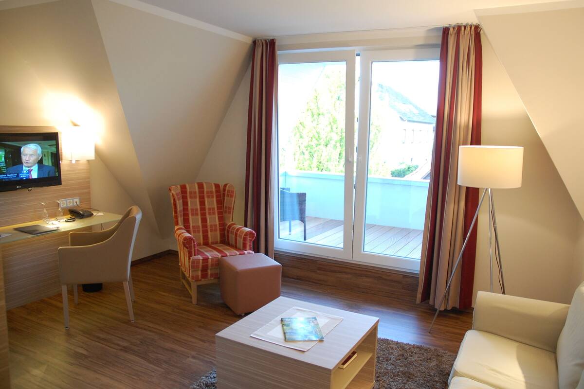 Chambre Double Confort | Coin séjour