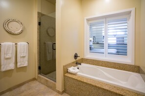 Combined shower/bathtub, designer toiletries, hair dryer, bathrobes