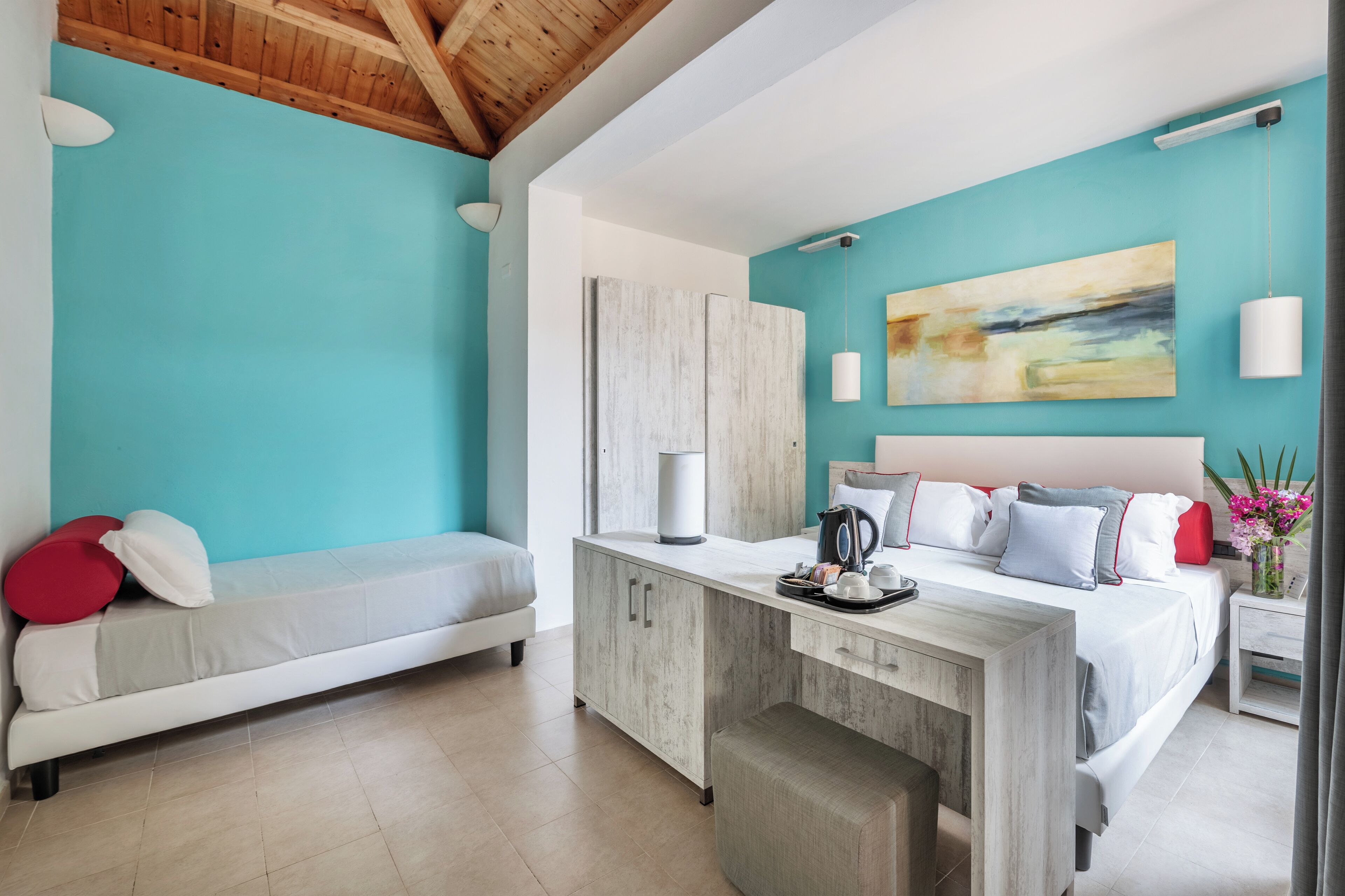 A modern bedroom with a bed, bedside table, and a bench.