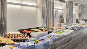 A buffet setup with various food items and a long serving table. - VOI Floriana Resort (Simeri-Crichi)