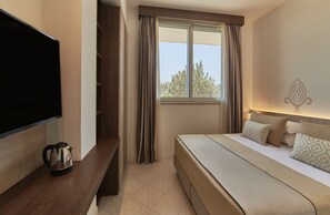 Family Quadruple Room | Down comforters, in-room safe, desk, laptop workspace - Granserena Hotel (Fasano)