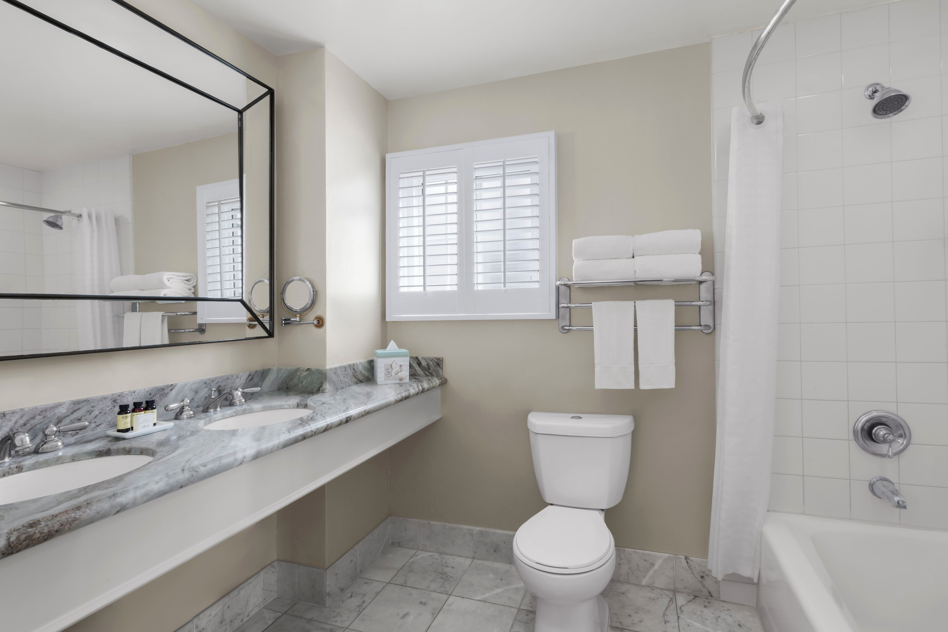 combined shower/bathtub, designer toiletries, hair dryer, bathrobes