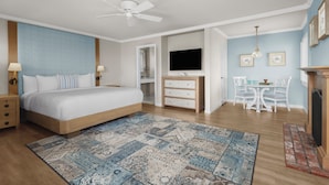 A bedroom with a bed, bedside tables, a desk, and a television. - Scripps Inn La Jolla Cove (La Jolla)