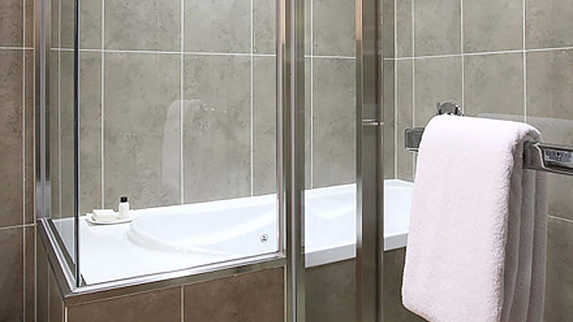 separate bathtub and shower, hair dryer, bathrobes, slippers