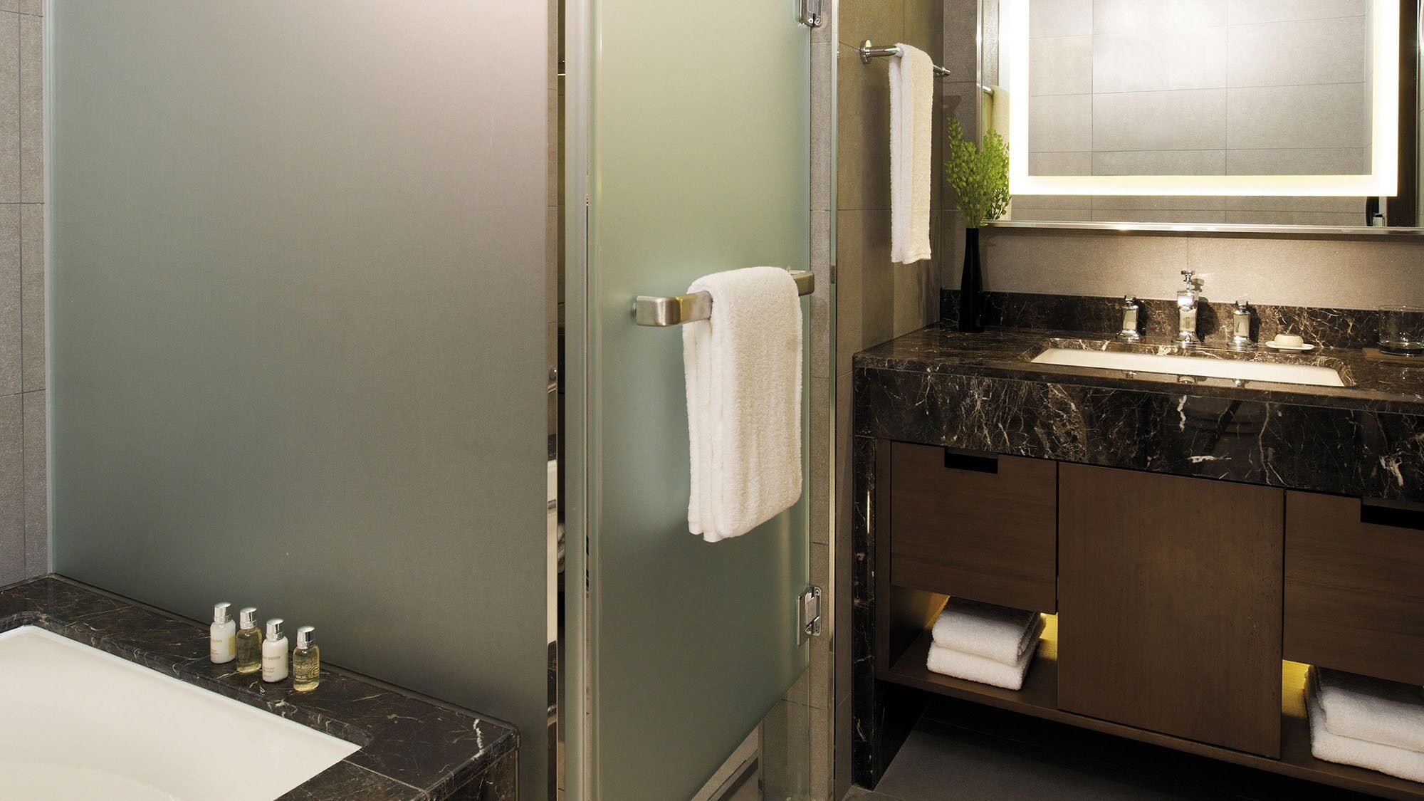 separate bathtub and shower, hair dryer, bathrobes, slippers