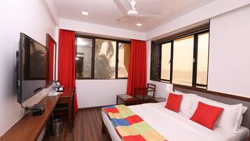 Habitación Deluxe | Ropa de cama de alta calidad y minibar