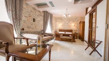 Luxury Suite | Minibar, in-room safe, individually decorated, individually furnished