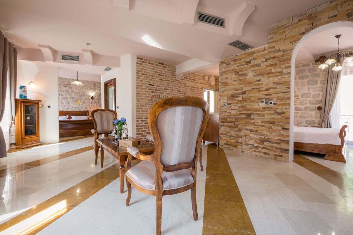 Standard Apartment, 2 Bedrooms, Balcony | Minibar, in-room safe, individually decorated, individually furnished