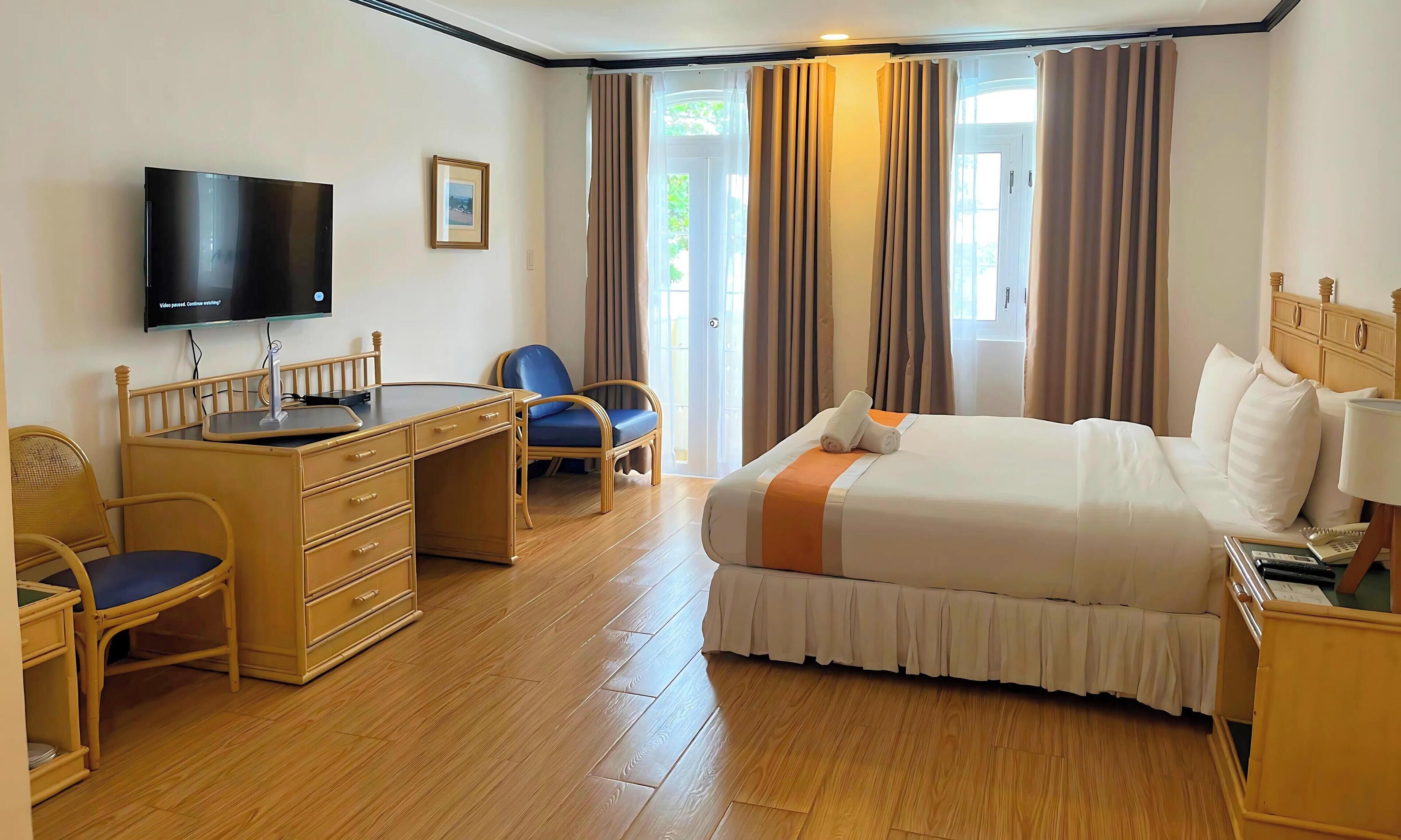 Yhden hengen deluxe-huone | Tallelokero huoneessa, ilmainen Wi-Fi, vuodevaatteet