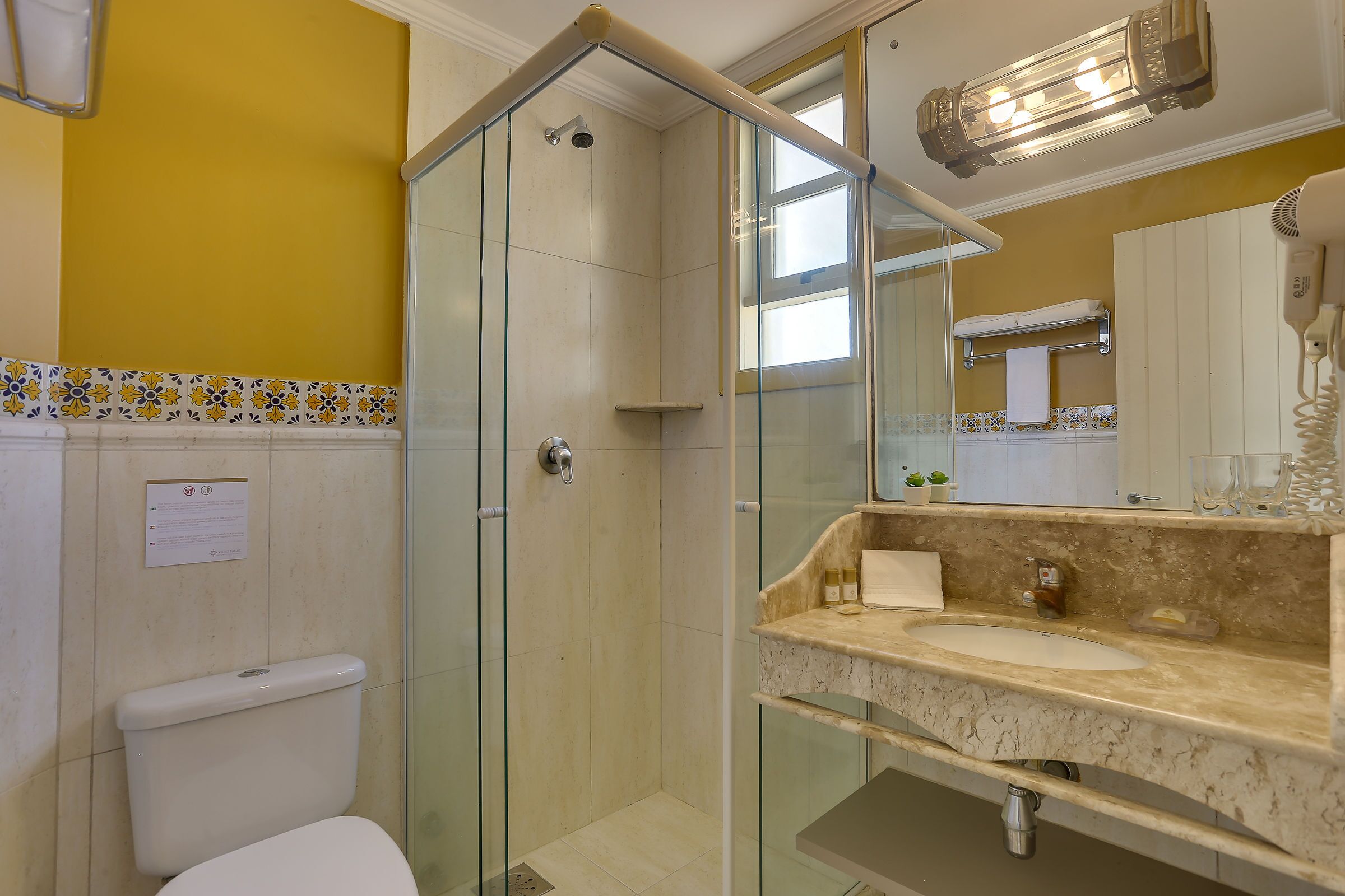 suite yellow tower label | bathroom | shower, free toiletries, hair dryer, towels