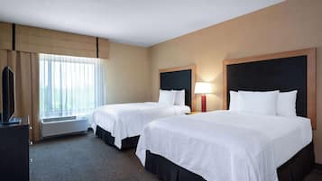 Suite, 2 Queen Beds, Non Smoking | Desk, laptop workspace, blackout drapes, iron/ironing board