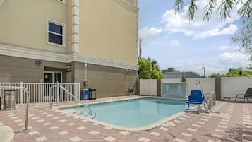 Outdoor pool, open 6:00 AM to 11:00 PM, pool umbrellas, pool loungers