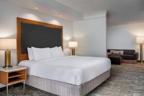 Premium bedding, desk, laptop workspace, blackout curtains