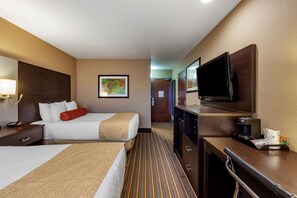 Cozy retreat with a large bed, two smaller beds, and a flat-screen TV.