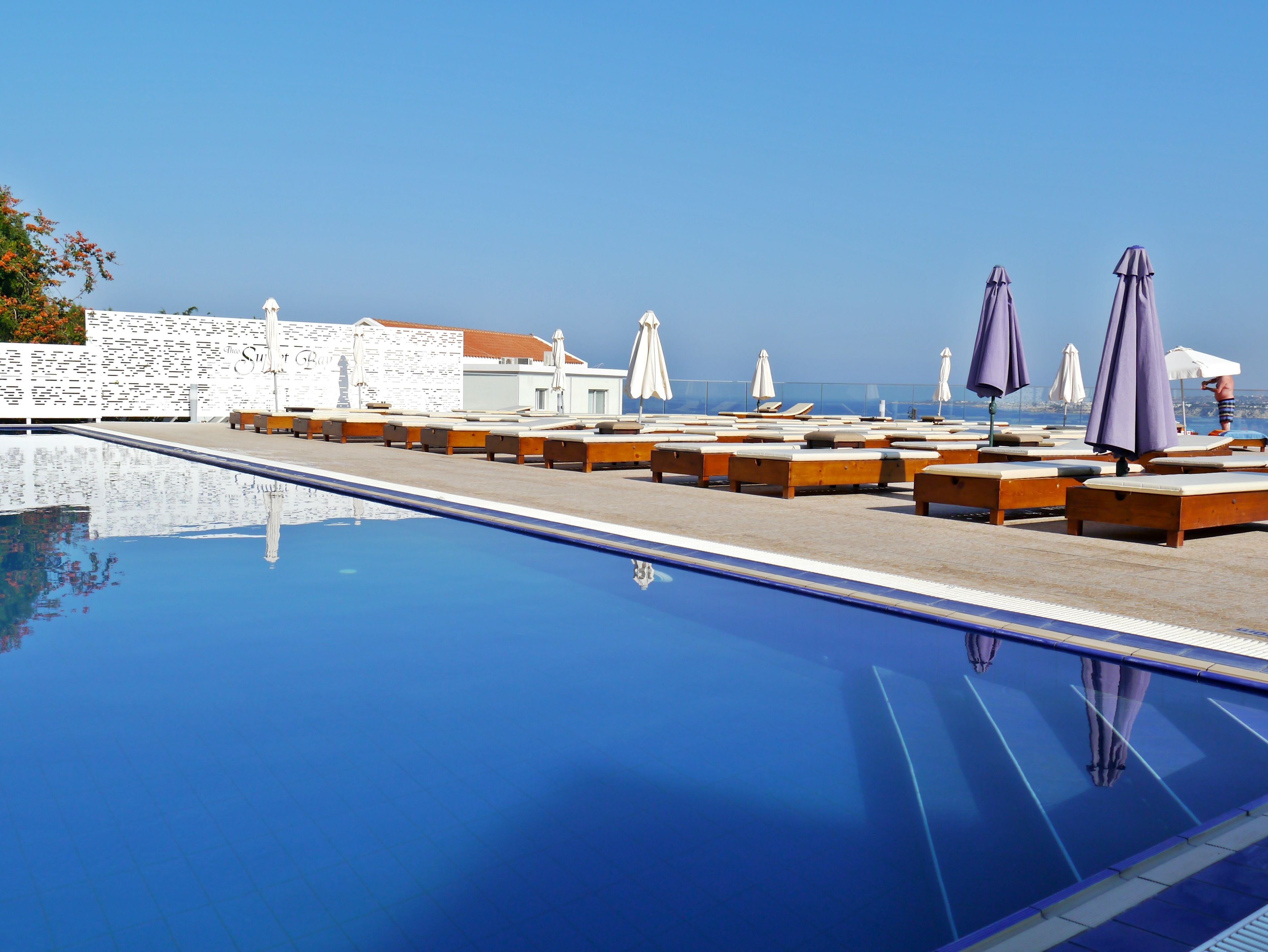 indoor pool, seasonal outdoor pool, pool umbrellas