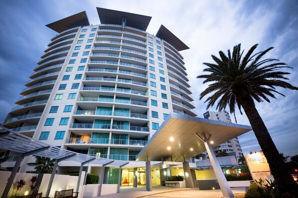 A modern hotel with multiple floors, balconies, and a covered entrance area. - Mantra Wings (Surfers Paradise)