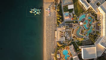 On the beach, sun-loungers, beach umbrellas, beach towels