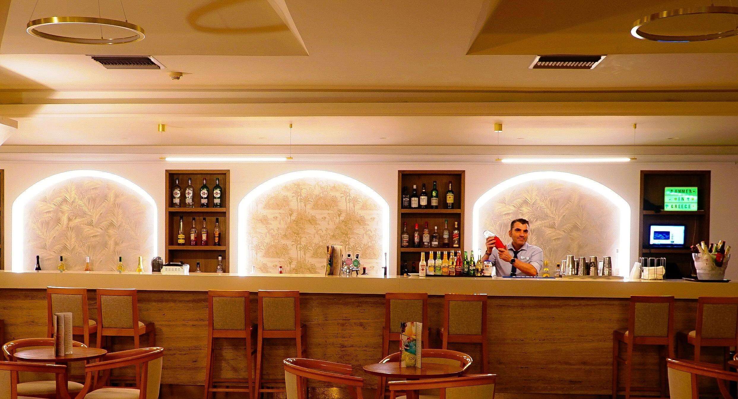 A bar area with wooden chairs and a counter.