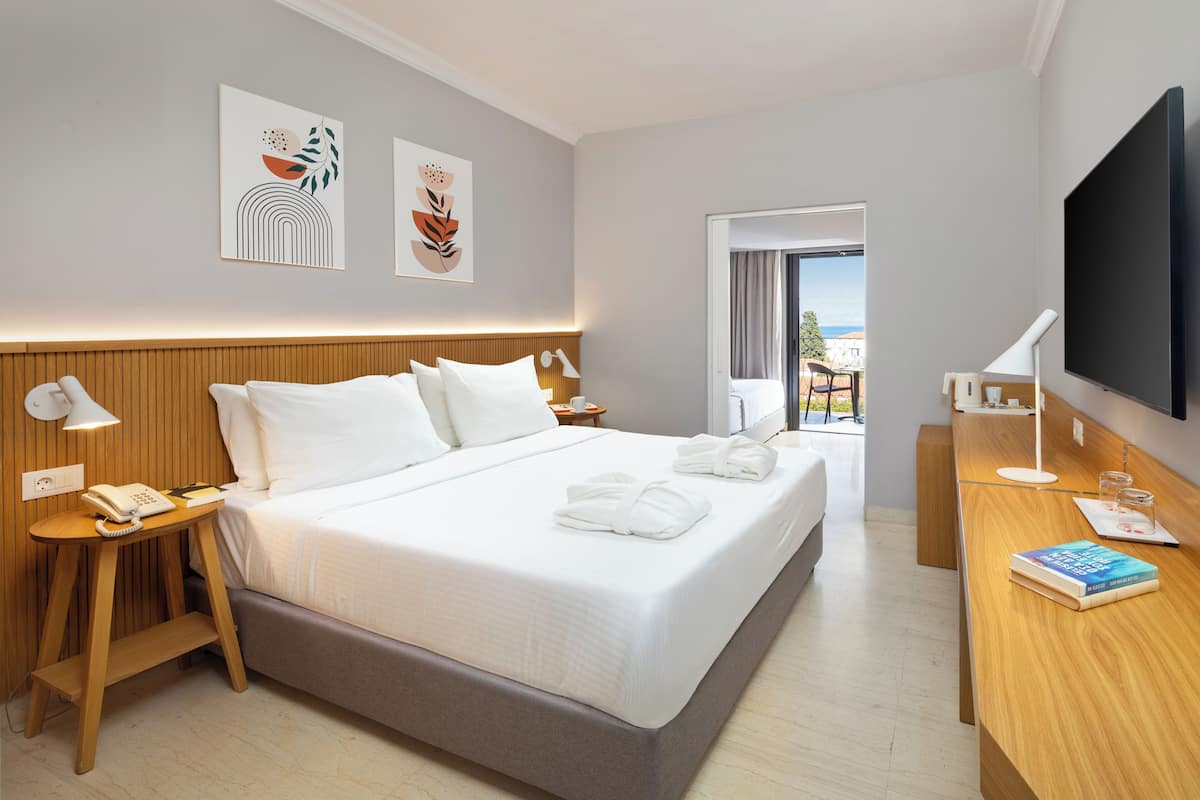 Family Room, Sea View | Free minibar, in-room safe, desk, blackout drapes