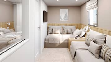 Habitación familiar, vista al jardín | Artículos del minibar gratis y caja de seguridad en la habitación