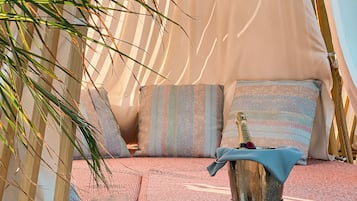 On the beach, beach cabanas, sun-loungers, beach umbrellas