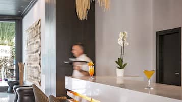 3 bars/lounges, poolside bar, beach bar