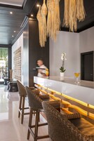 3 bars/lounges, poolside bar, beach bar