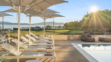 Outdoor pool, pool umbrellas, pool loungers