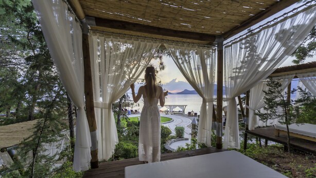 A covered outdoor area with a view of a lake and mountains. - Liberty Lykia  - Adults Only (Fethiye)