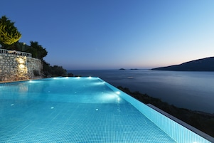 Seasonal outdoor pool, open 10:00 AM to 7:00 PM, pool umbrellas