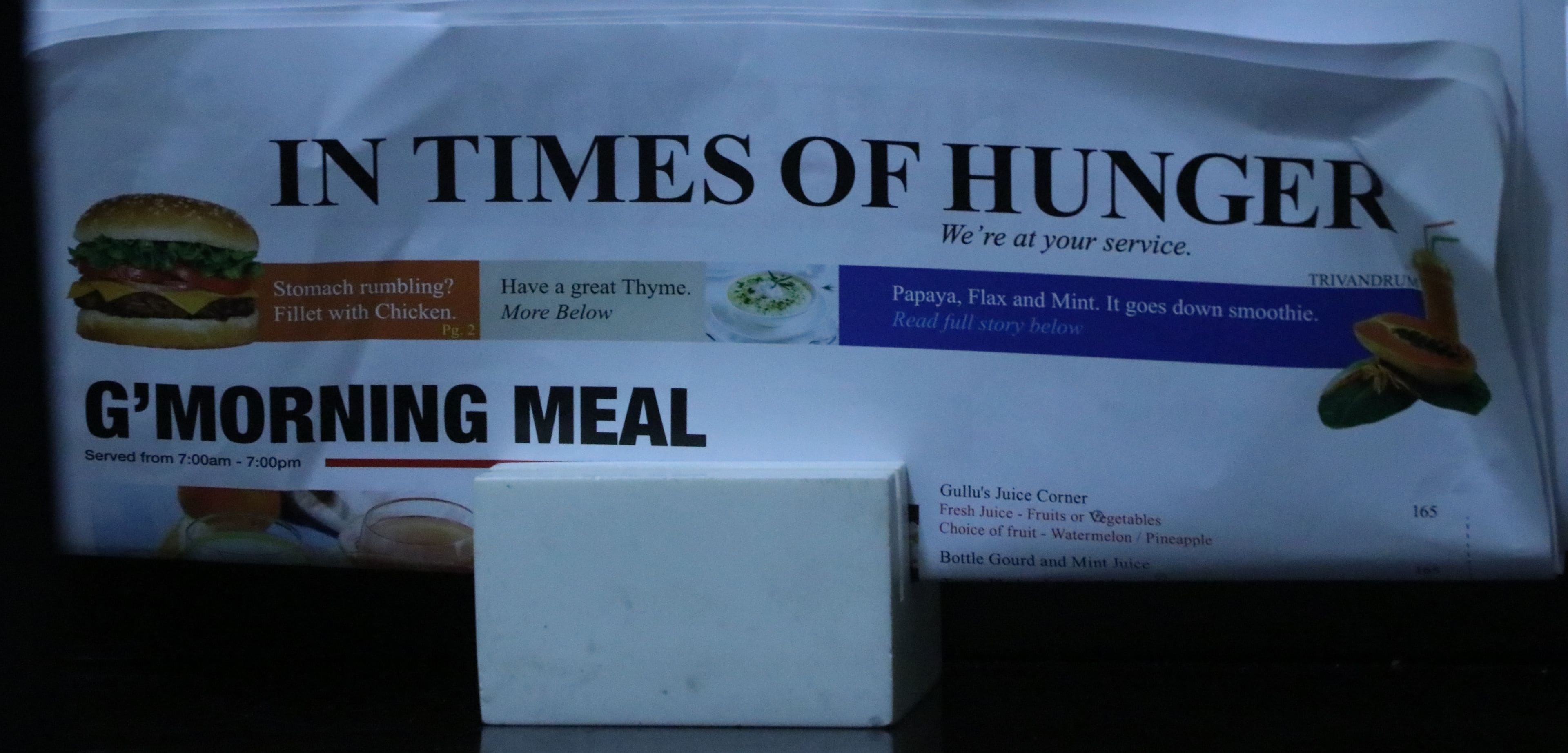 A menu titled "IN TIMES OF HUNGER" with a section for "G'MORNING MEAL" served from 7:00am to 7:00pm.