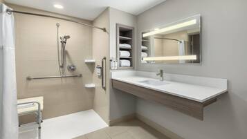 Standard Room, 1 King Bed, Roll-in Shower (Mobility Accessible) | Bathroom | Combined shower/bathtub, free toiletries, hair dryer, towels